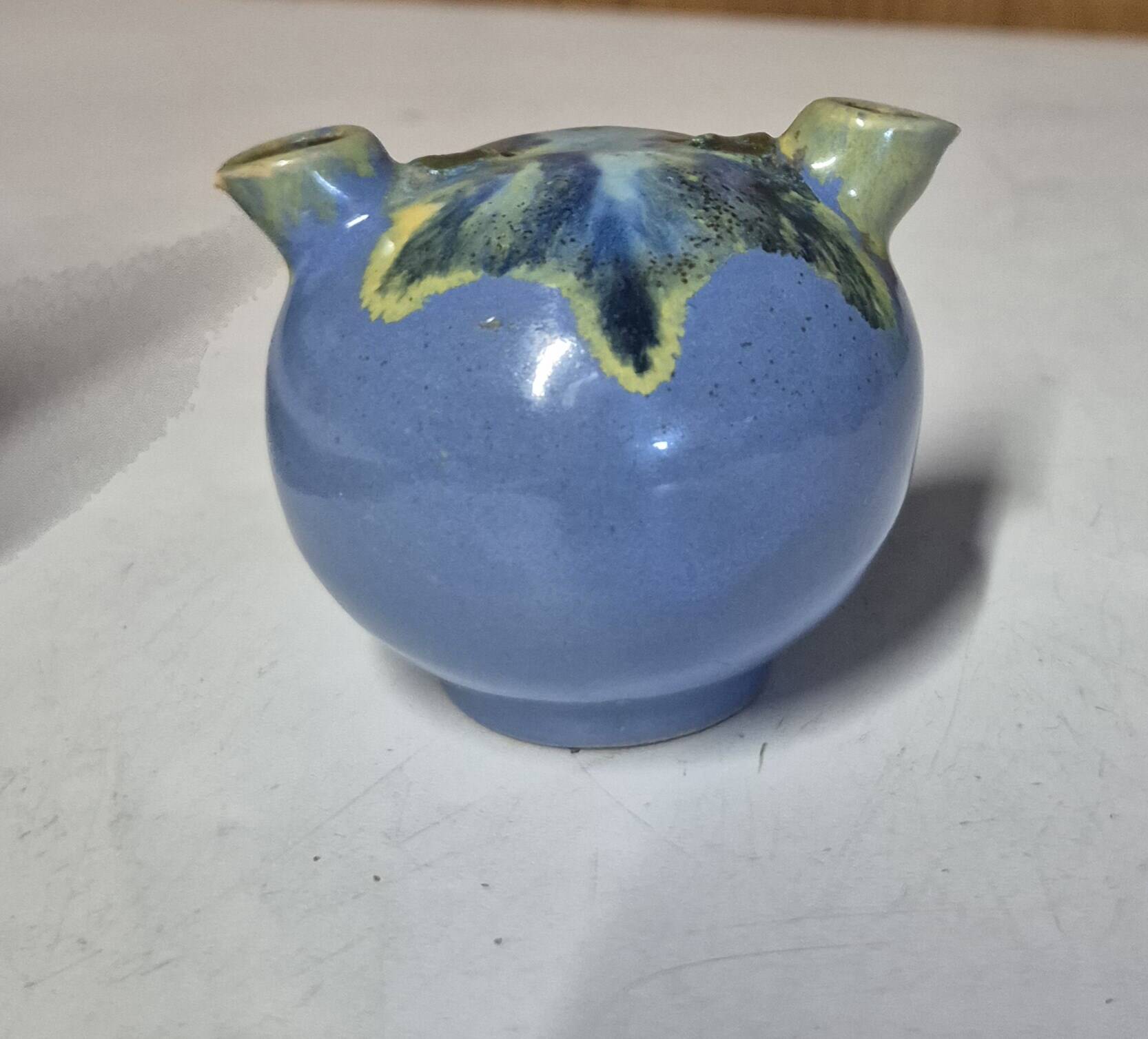 Glazed ceramic flower spike vase stamped "to be defined"