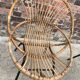 Trio of vintage rattan shell armchairs with metal legs, antique wicker seating furniture