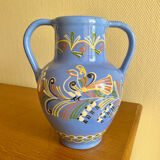 Glazed blue ceramic vase with folk decoration