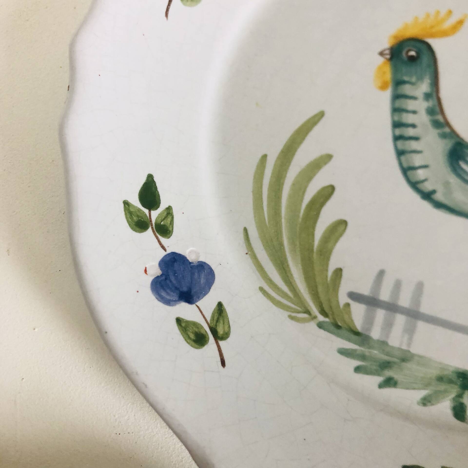 Pair of plates with naive Eastern rooster decoration
