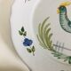 Pair of plates with naive Eastern rooster decoration