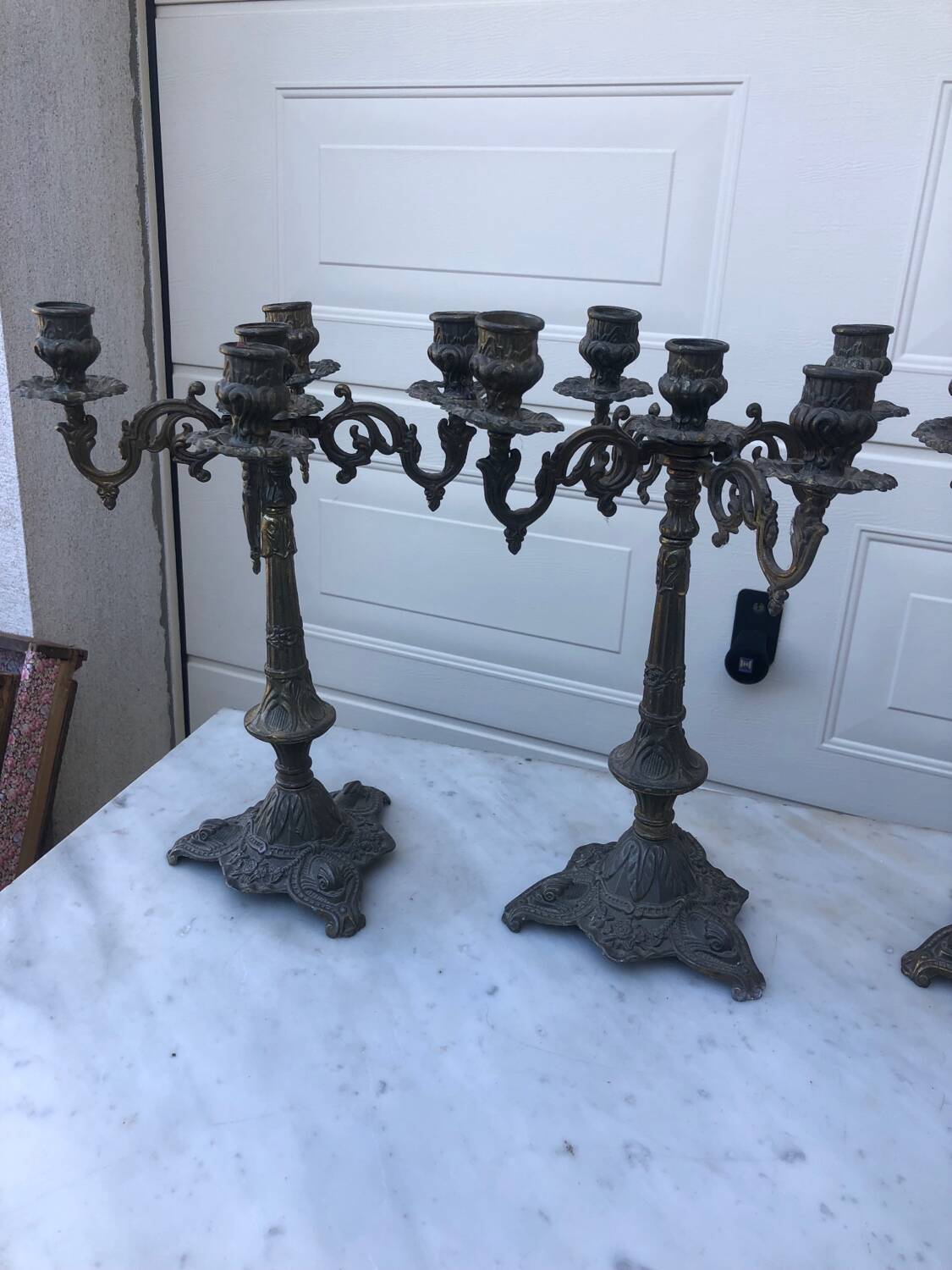4 identical old brass candlesticks