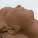 Bust young smiling girl. Circa 1900. Art Deco. Signed.