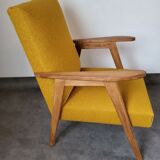 Curly yellow Scandinavian armchair