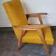 Curly yellow Scandinavian armchair