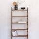 Woven rattan shelf and black metal