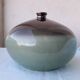 Green and brown ceramic vase