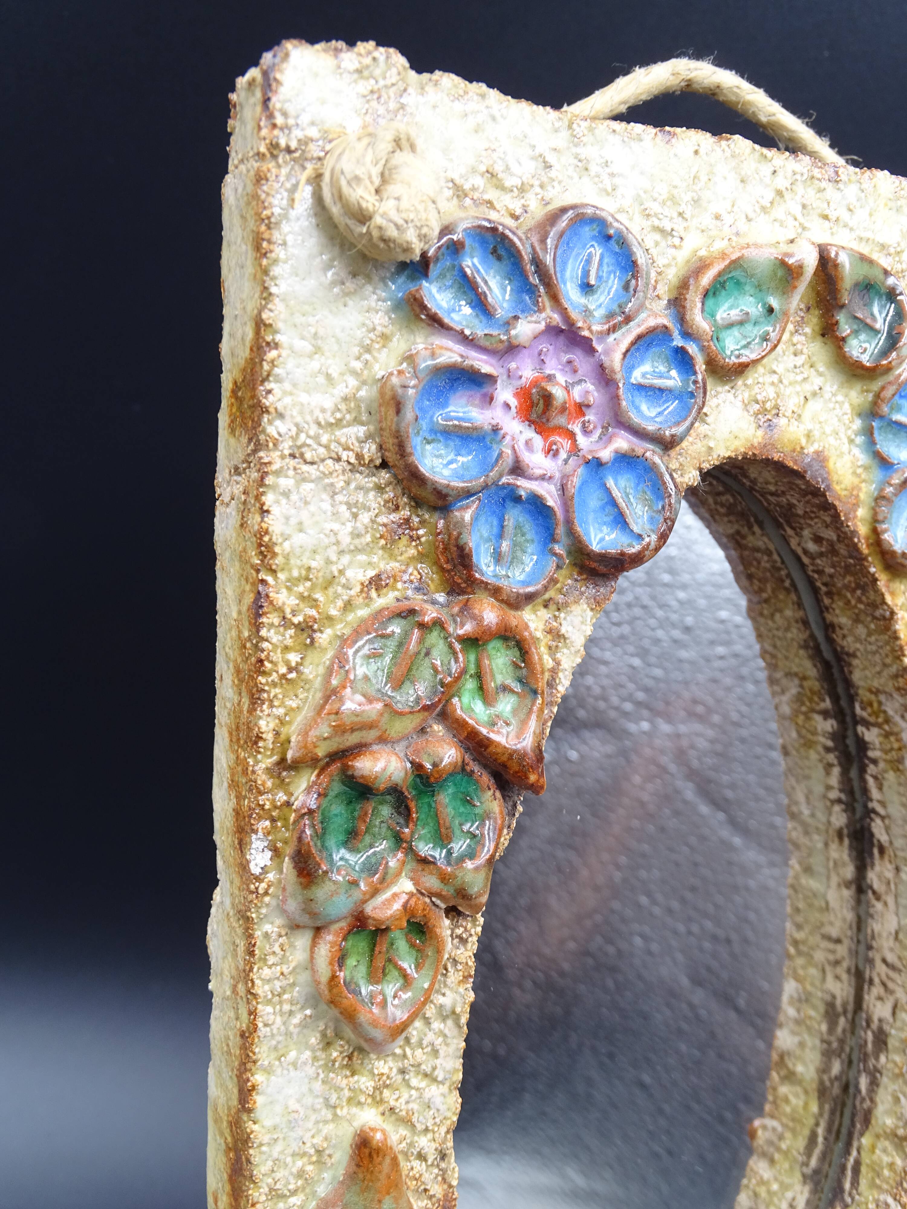 Flower-decorated sandstone mirror, circa 1970