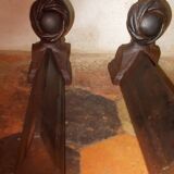Old cast iron andirons with oriental decor