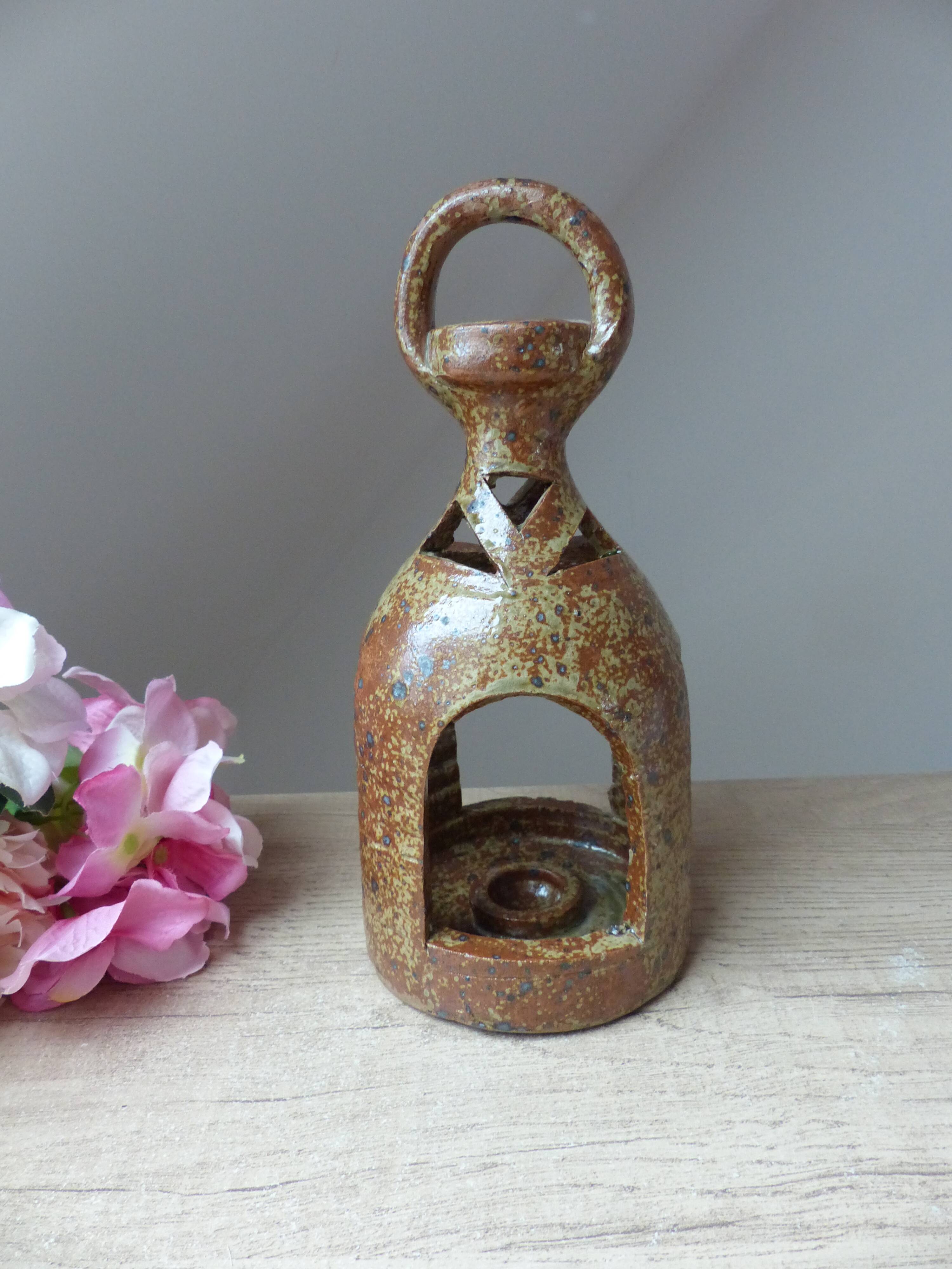 Old candle holder lantern in pyrite sandstone, decorative lantern