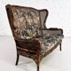 Wingback 2-seater sofa in carved wood, cane and fabric