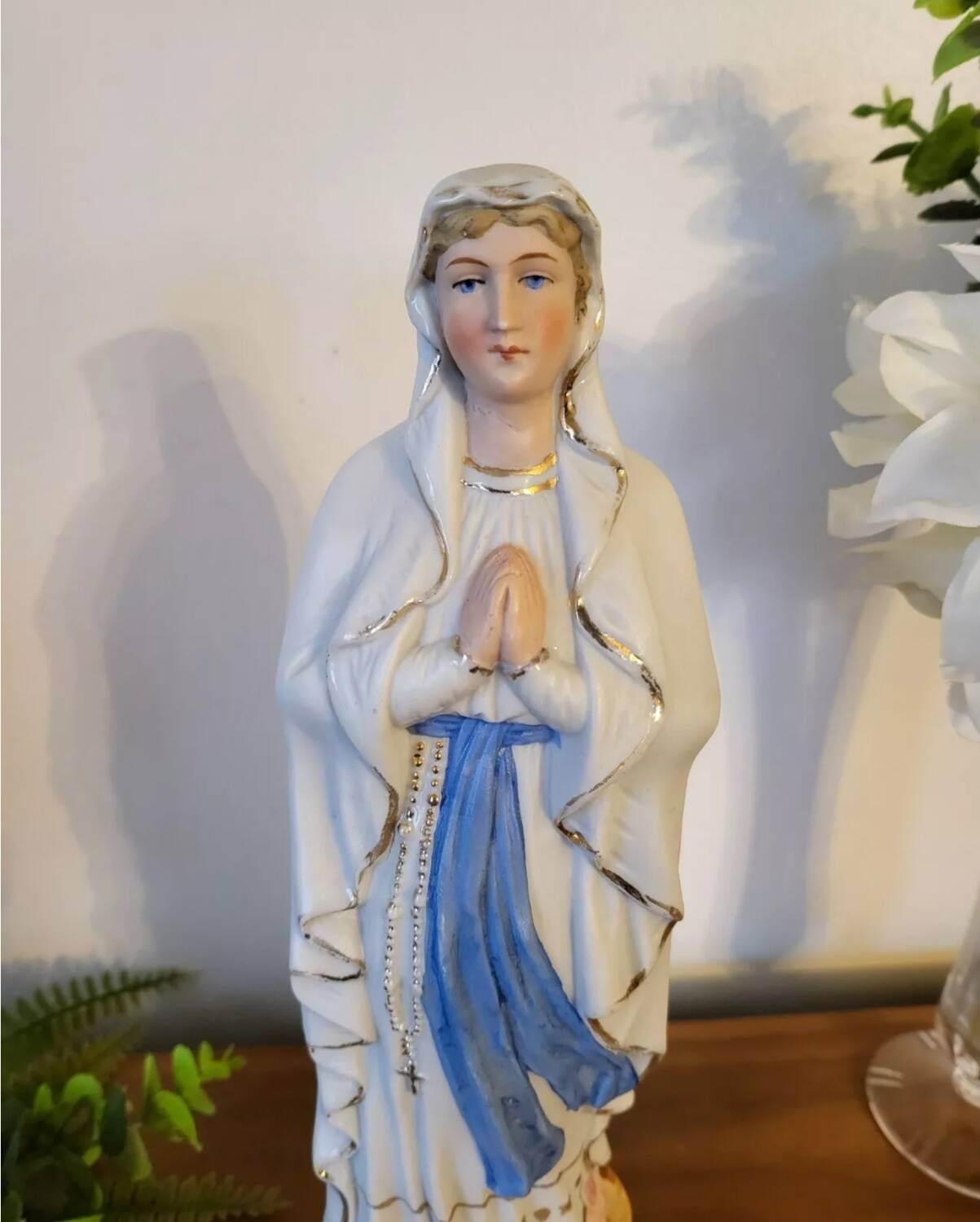 Religious statuette of the Virgin Mary in bisque porcelain