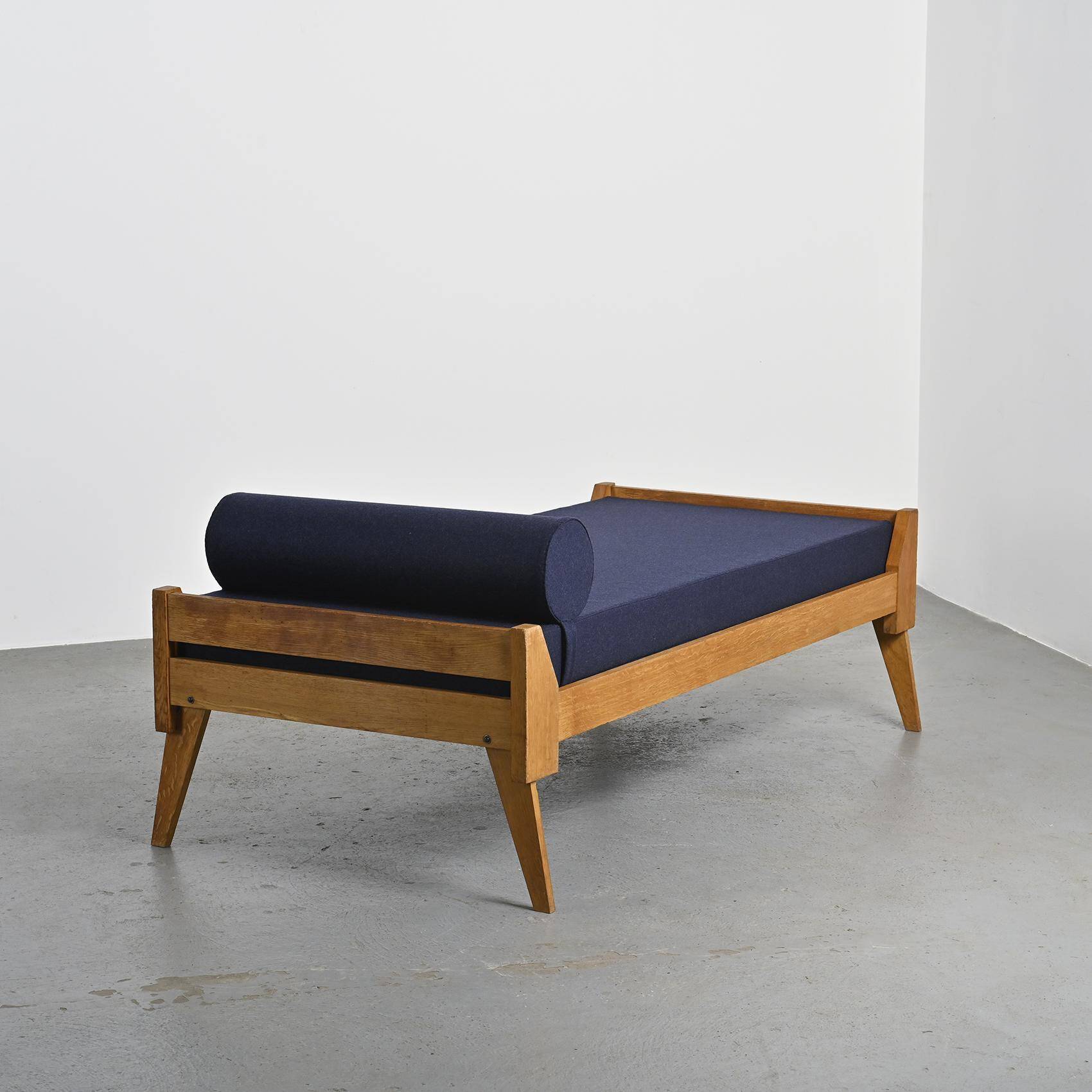 Wooden bench with midnight blue fabric, France, circa 1955