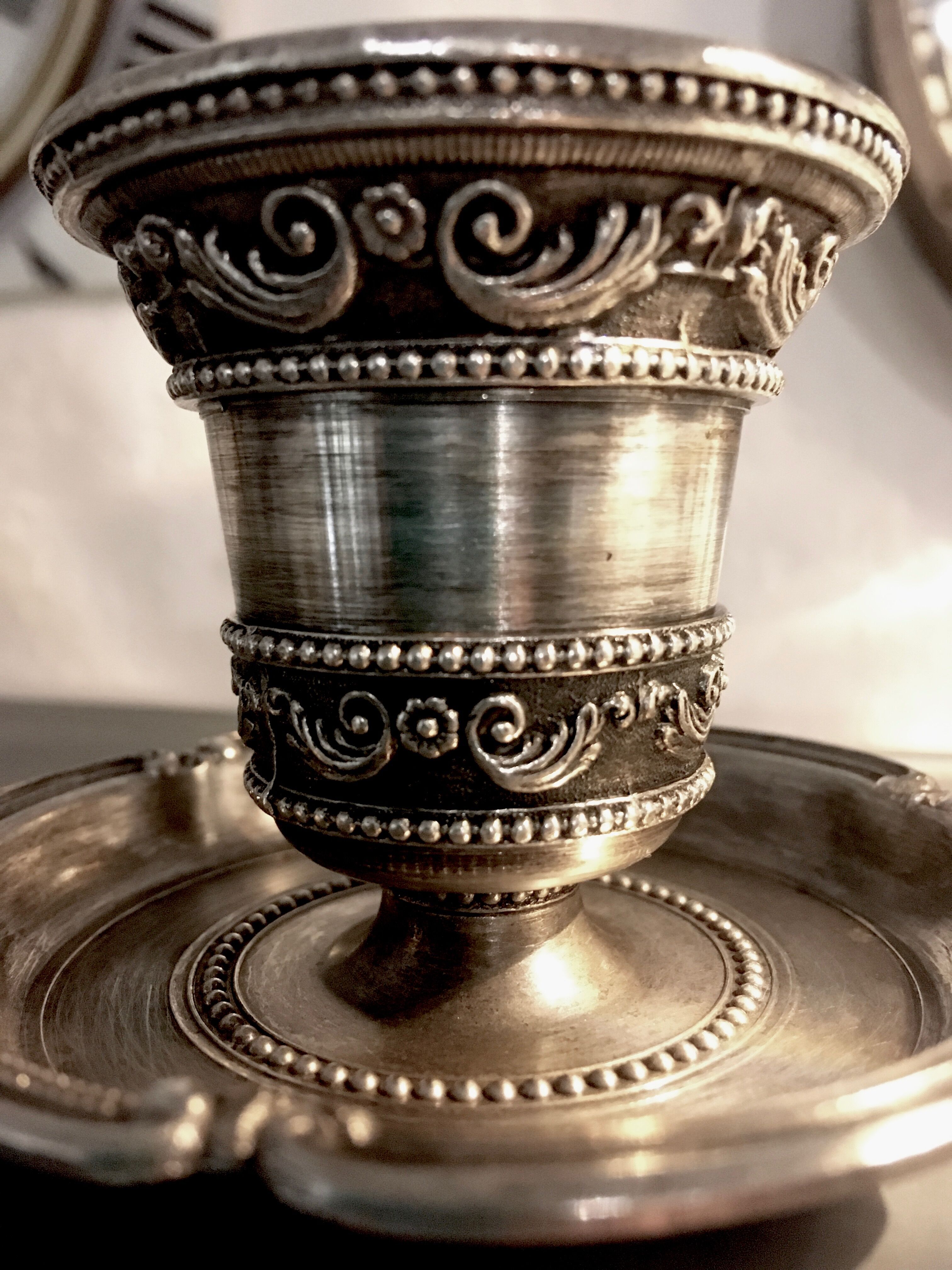 Chiseled silver metal candle holder