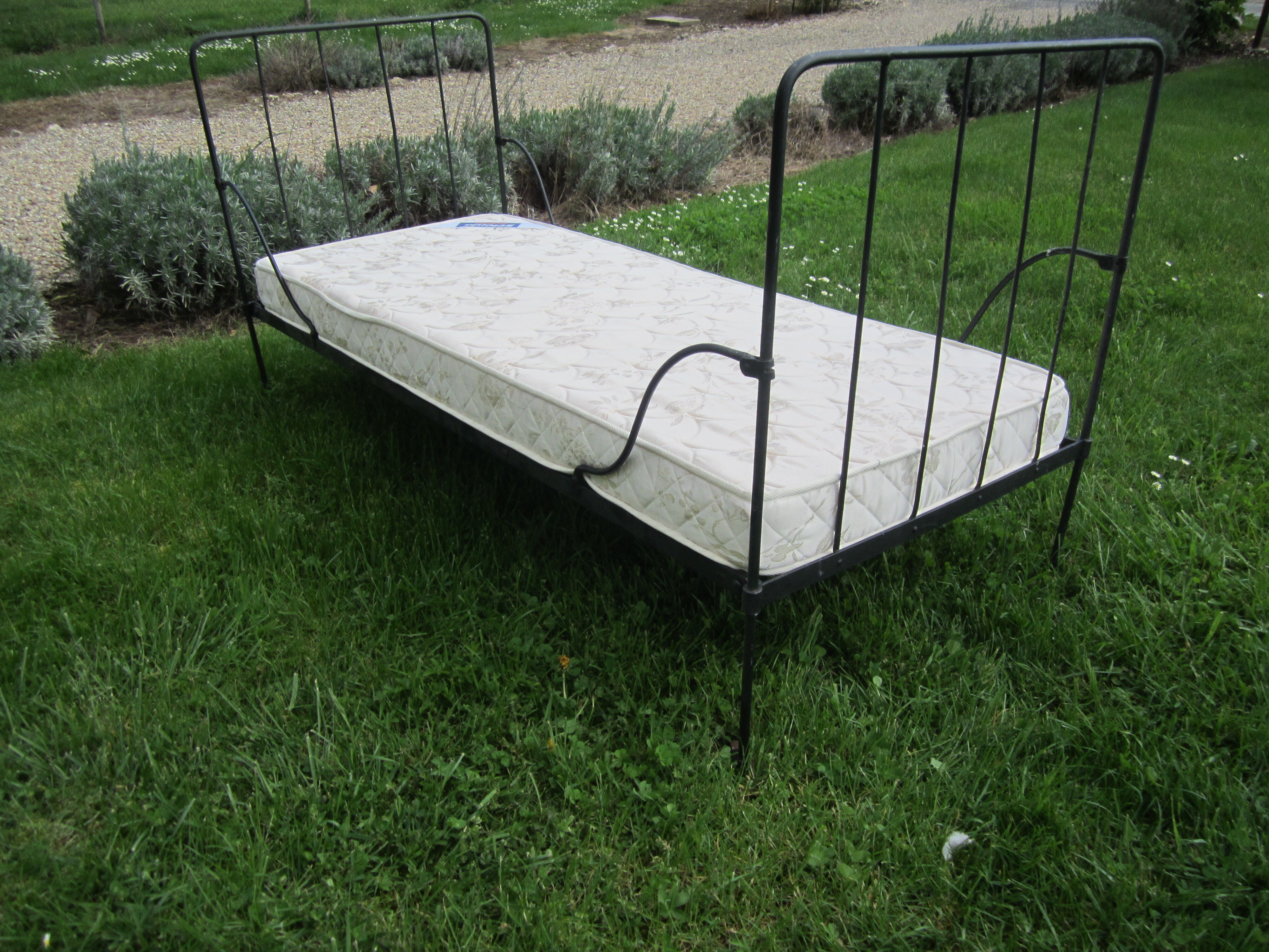 Wrought iron bed with mattress