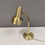 Older Swedish table lamp, estimated 1980s, in gold-colored aluminum with “bend”.