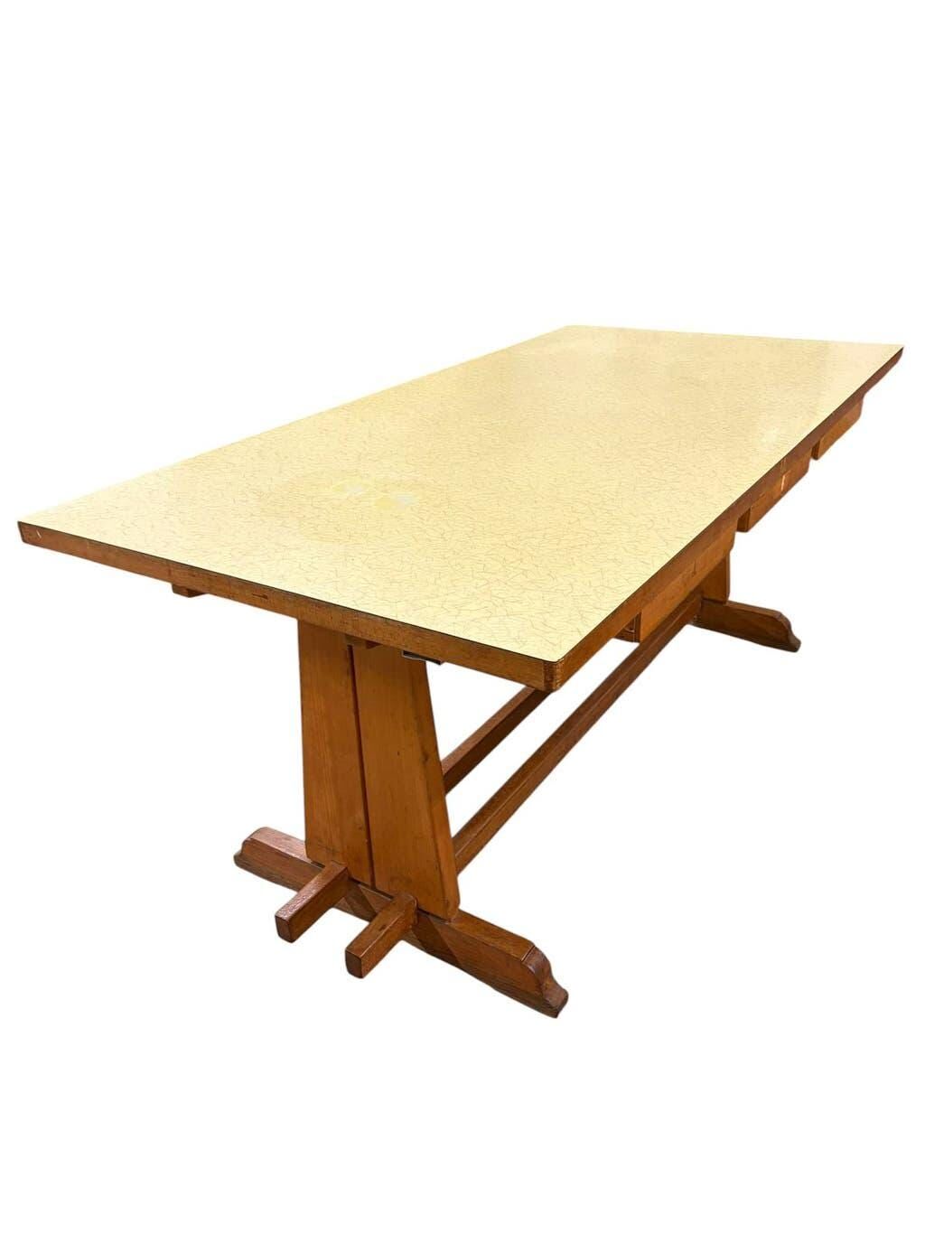 Vintage wooden table with a yellow formica top.