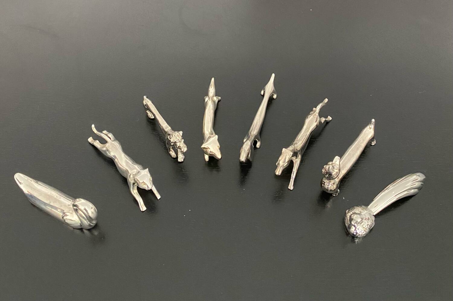 8 various animal knife holders in silver-colored metal