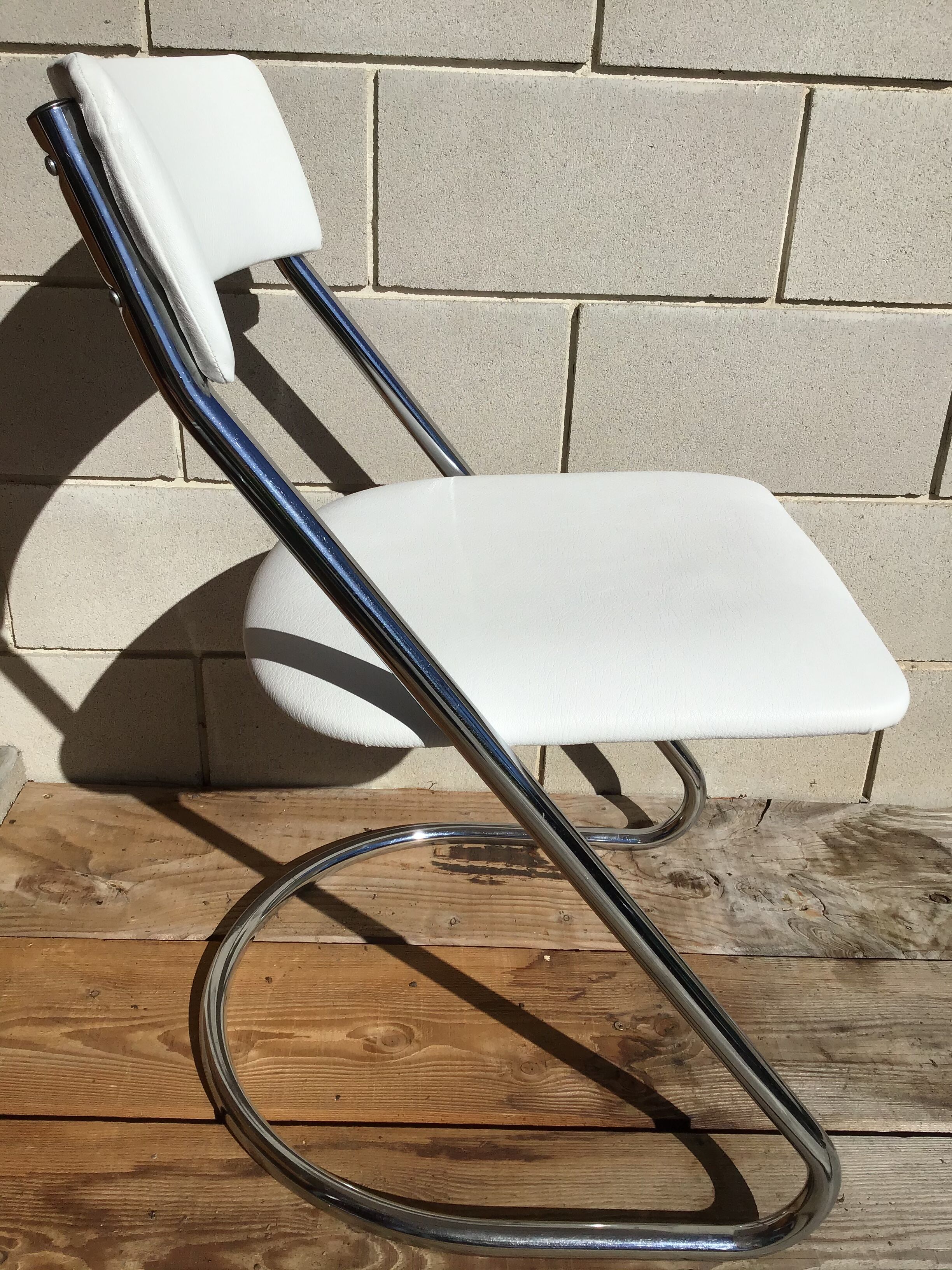 White faux leather sled chair