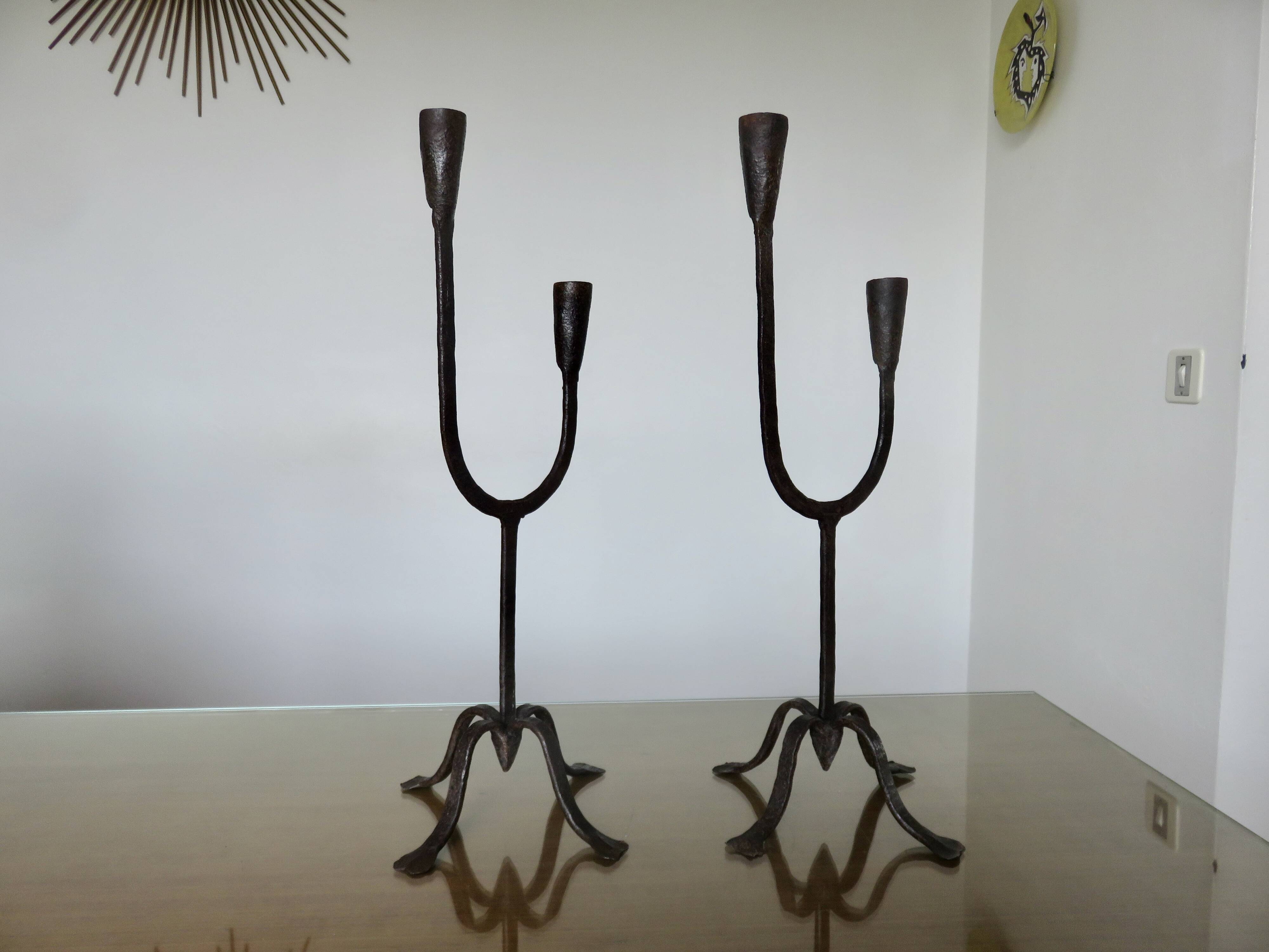Pair of antique wrought iron candlesticks