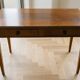 Antique office set: wooden table and matching armchair.