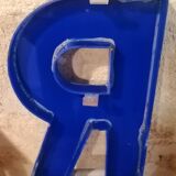 Letter R vintage sign in blue plexiglass