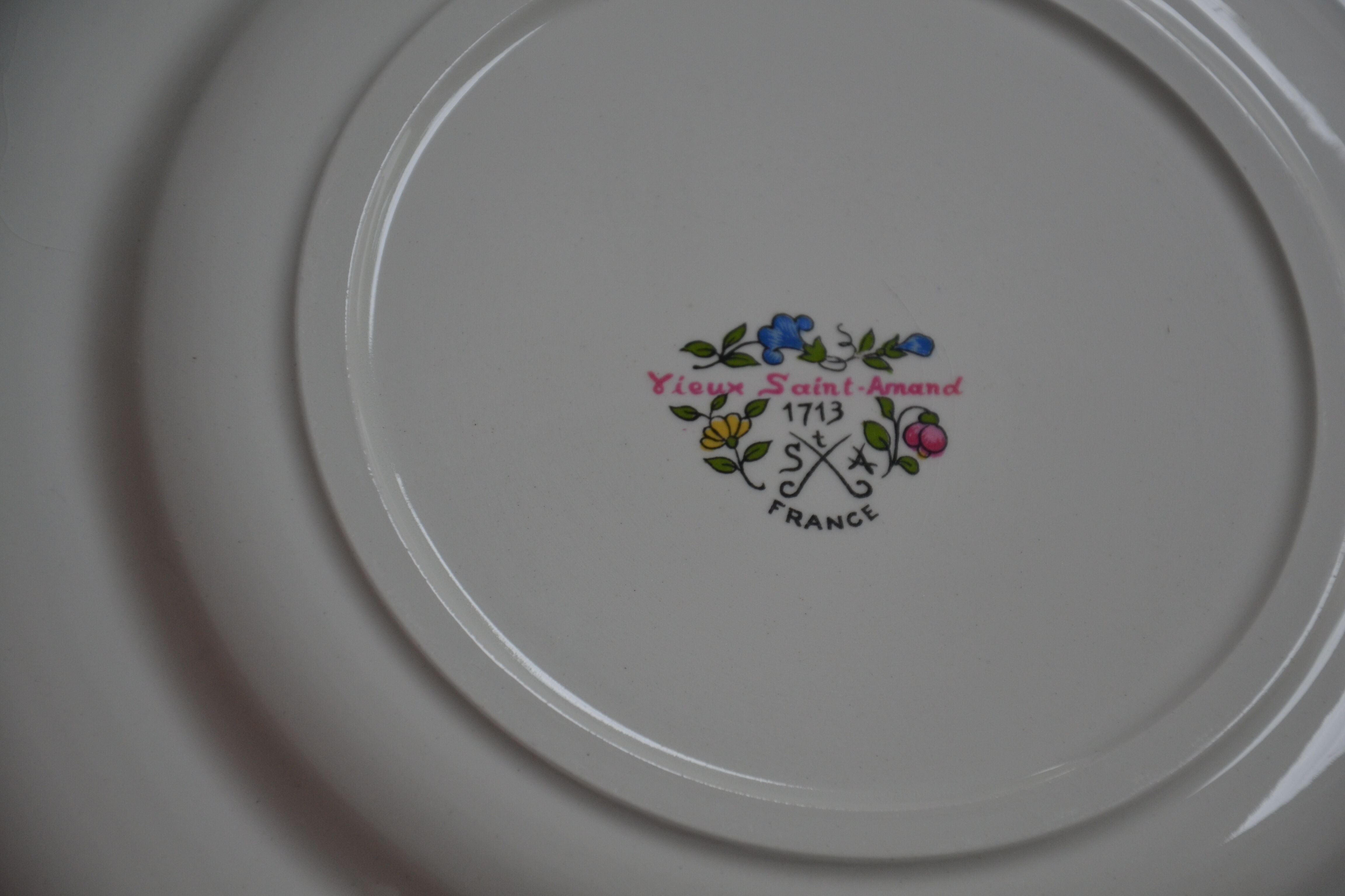 12 old St Amand flat plates 1713