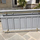 Grey lacquered wooden bar cabinet, golden brass bar