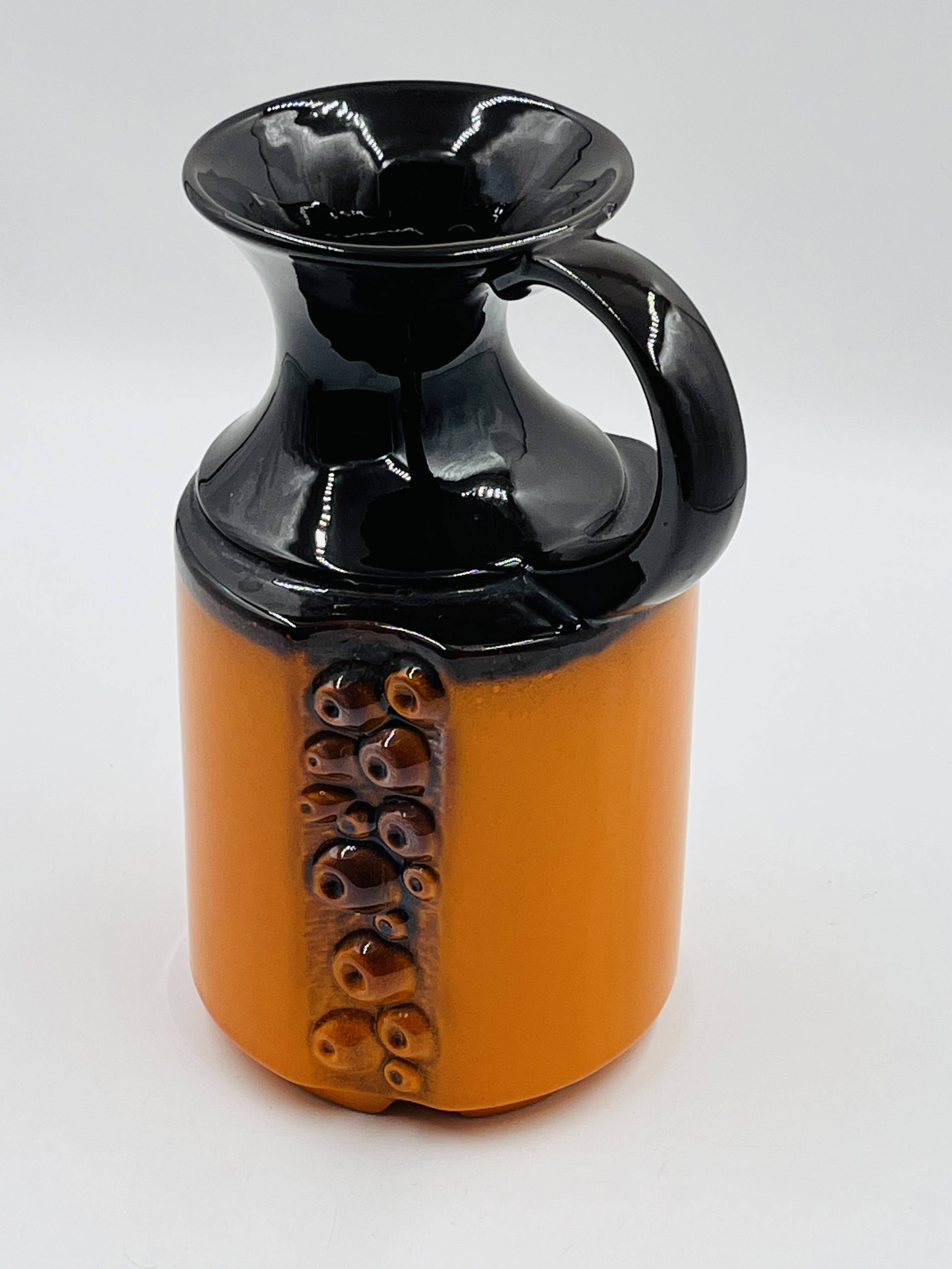 Modernist vase design, orange ceramic with relief cabochons from the 1970s.