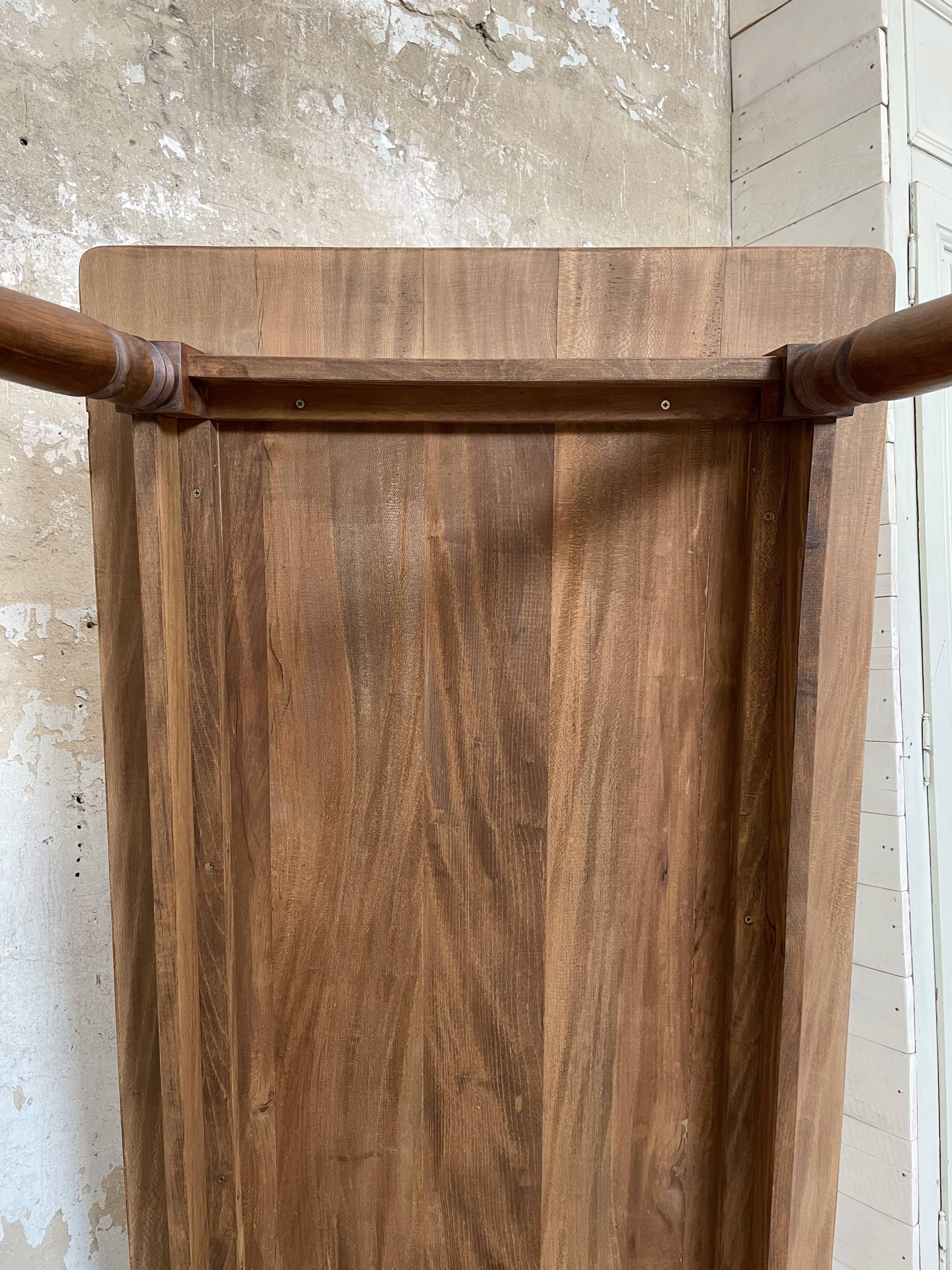 Vintage farmhouse table with turned legs.