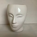 Man's head hide pot vase