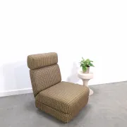 Vintage pull-out sofa bed, brown checked lounge chair with chrome.