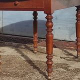 Old extendable round table in fruit wood with folding sides