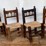 Series of 4 brutalist rustic chairs in carved wood straw seat