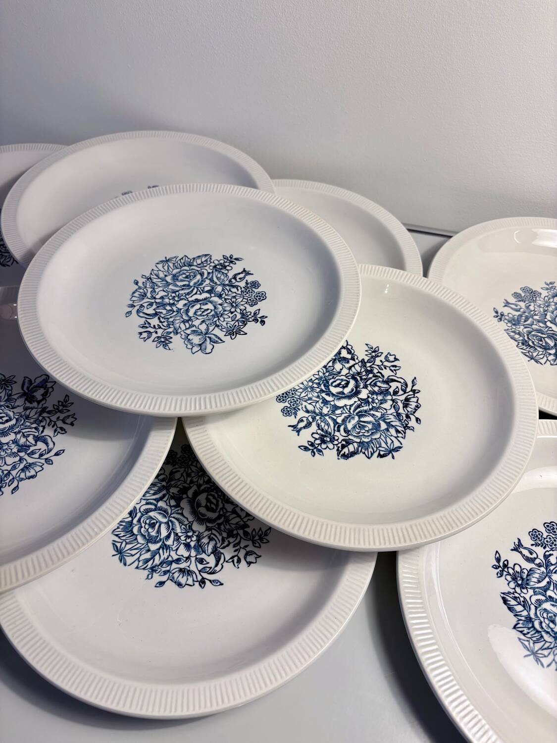 Set of 10 antique Lunéville flat plates – blue floral decoration