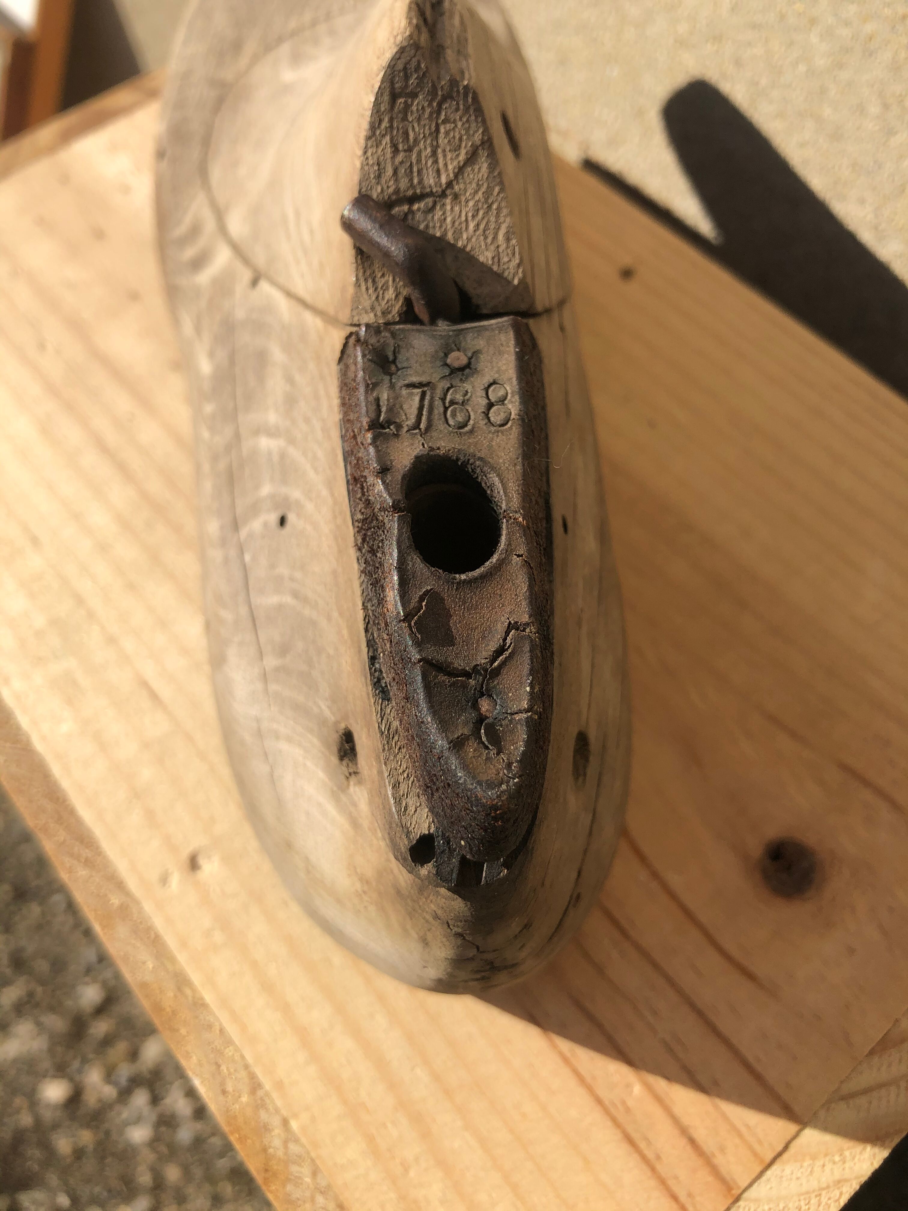 Old wooden and metal shoe tree