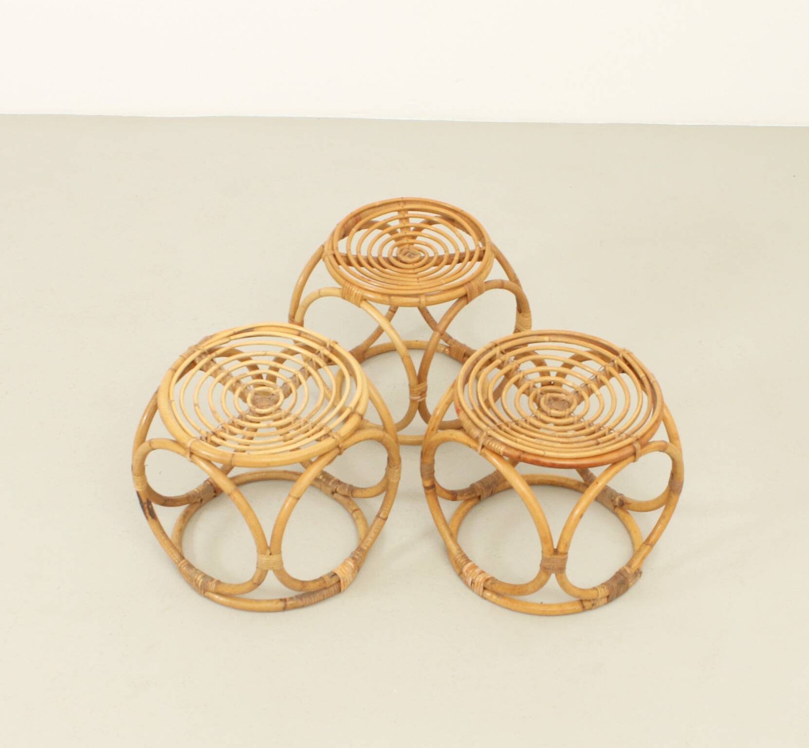 Set of three 1970s rattan stools, Spain.