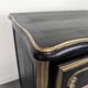 Commode de style Louis XV en chêne laqué noir et rechampi or