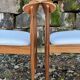 A set of GPlan chairs in teak with a white woolly fabric