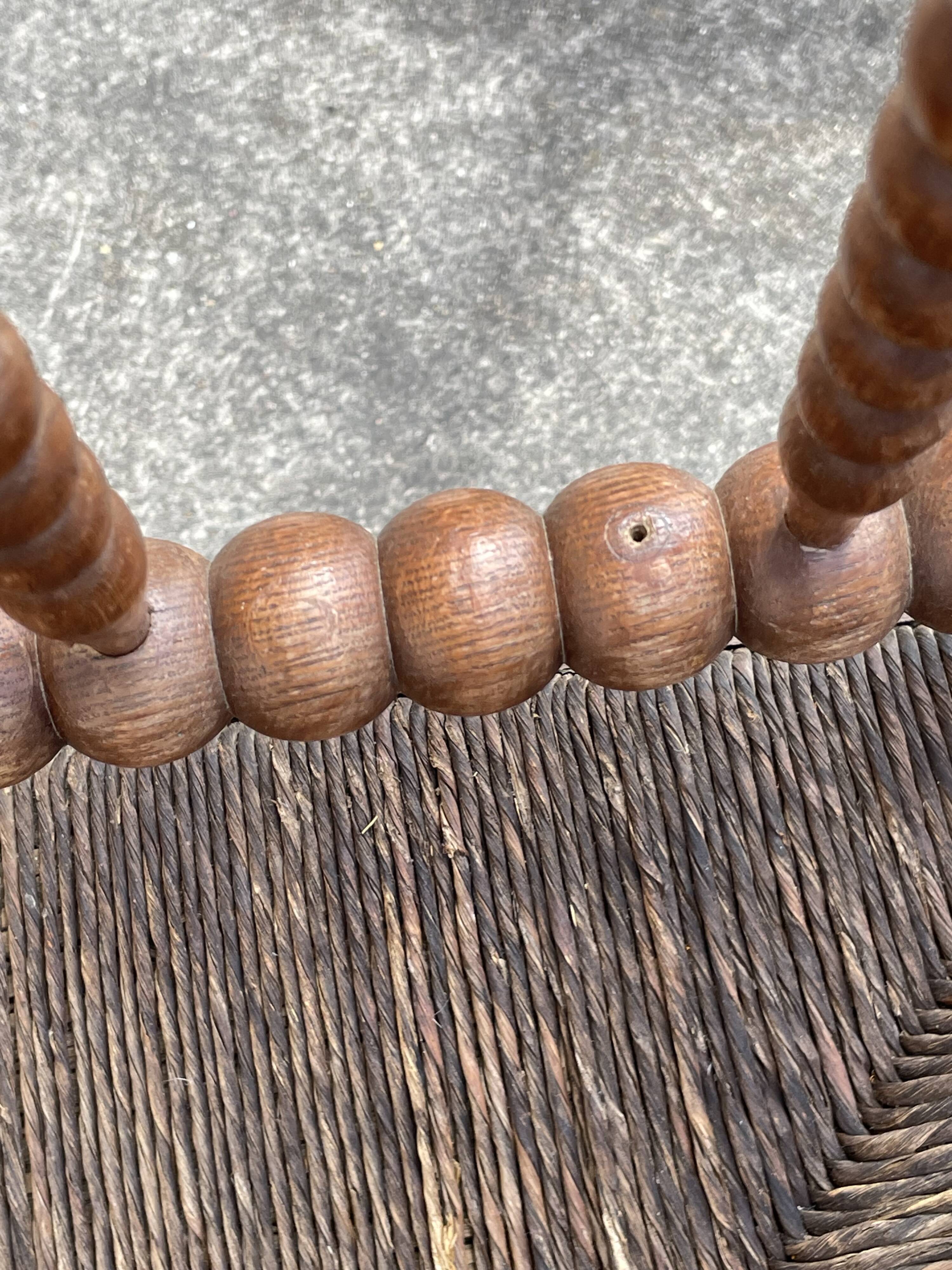 Antique Bobbin armchair with straw seat