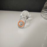 Crystal bottle with silver metal neck rim