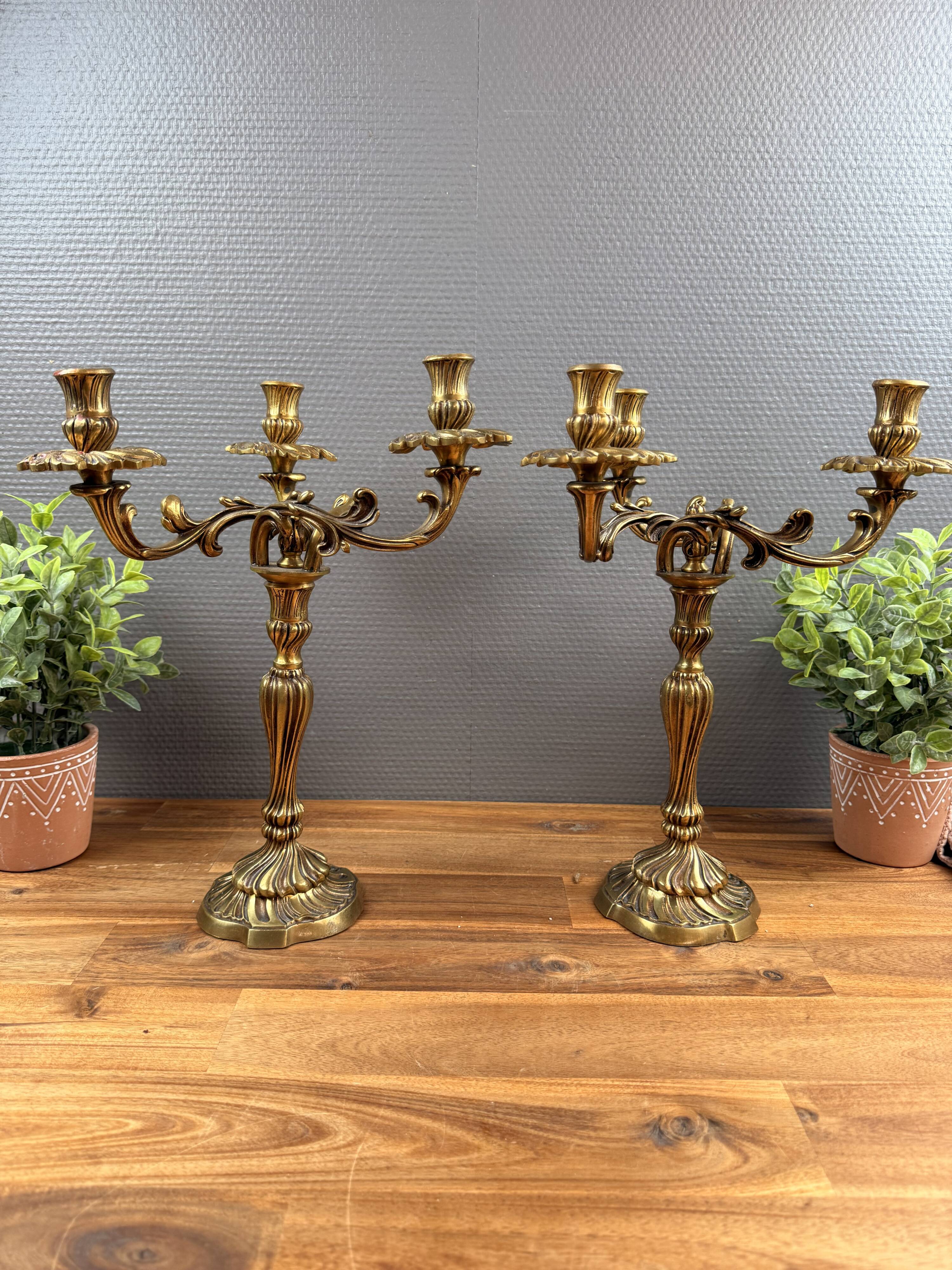 Pair of antique bronze candlesticks, Louis XV style