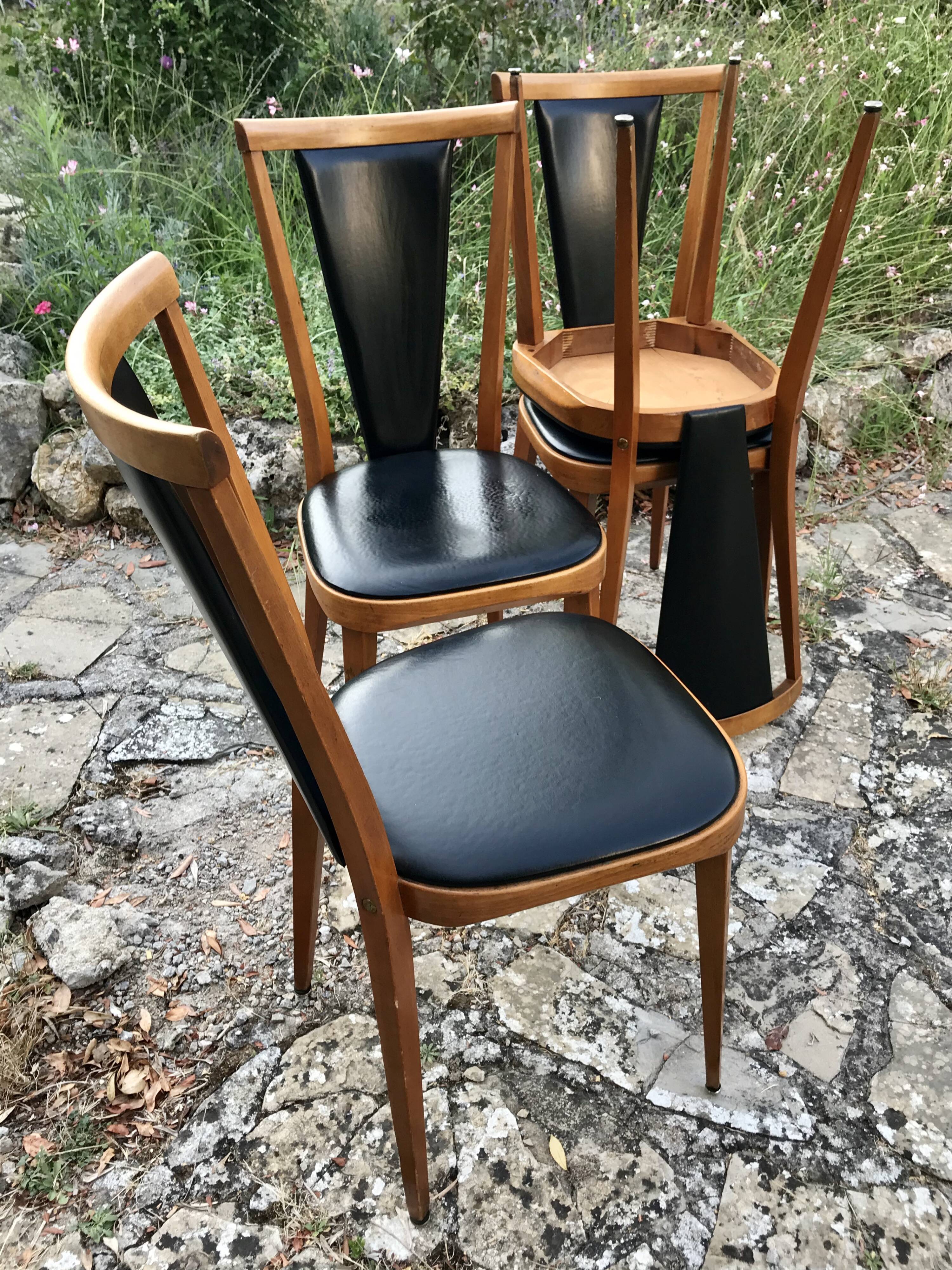 Four vintage beech and skai chairs