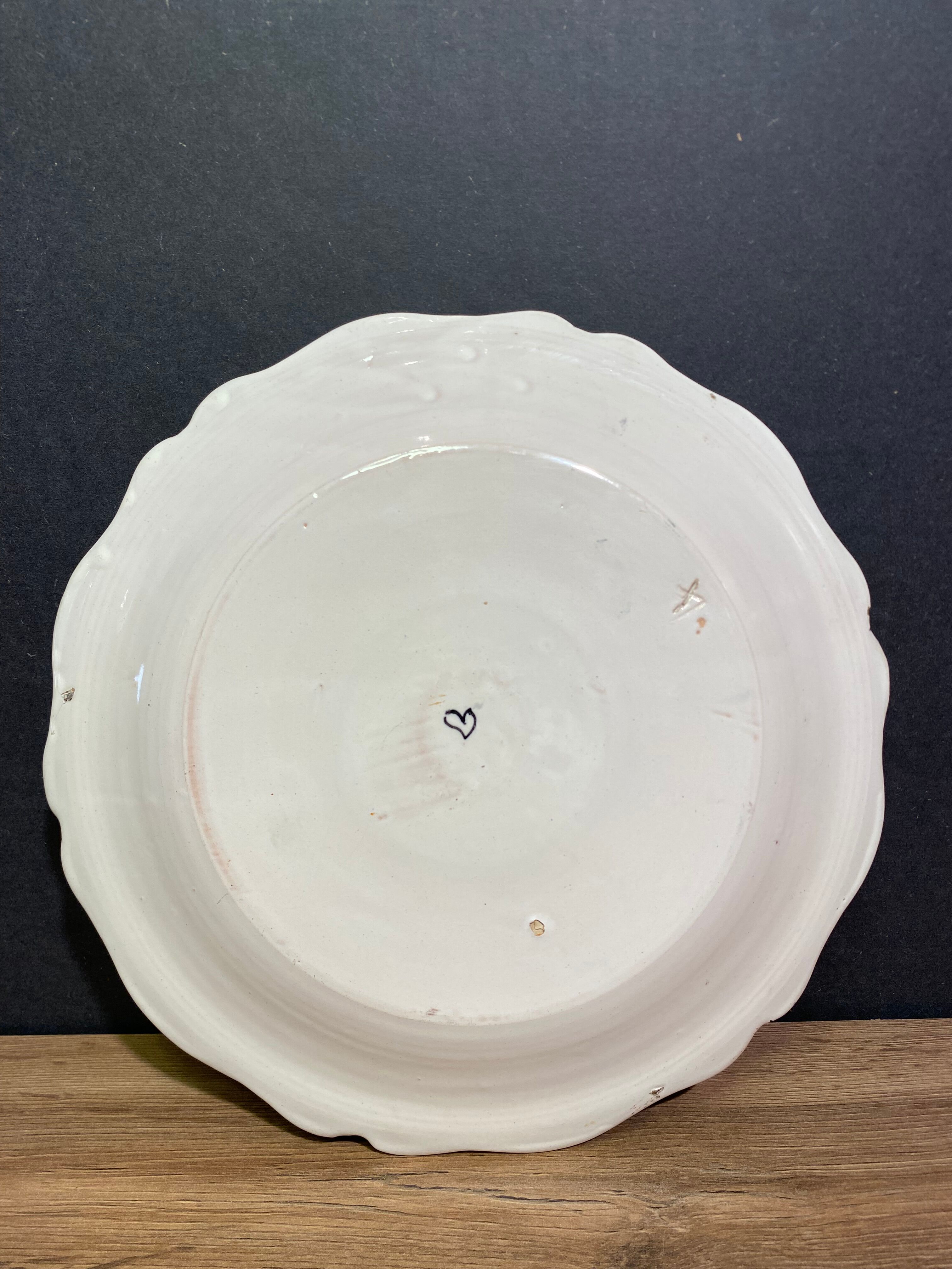 Faience dish of eighteenth-century style nevers decorated with basket with bunches of grapes