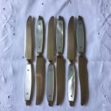 Old brass forks and knives and mother-of-pearl handle