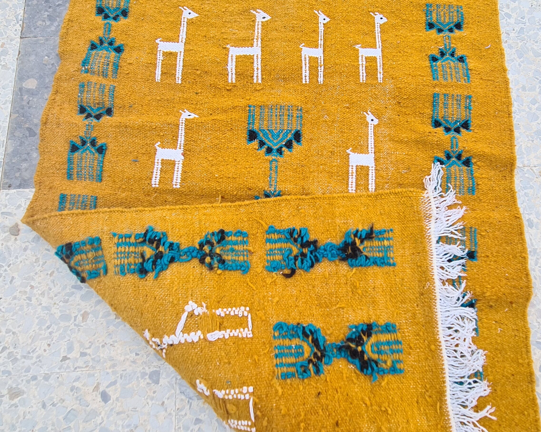 Traditional handmade gazelle-patterned carpet in pure wool