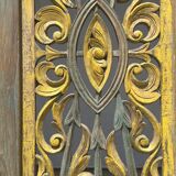 Rectangular Indonesian construction element with blue and yellow plant in carved wood