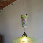 "Very old light fixture" with a "rise and fall" counterweight adorned with butterflies.