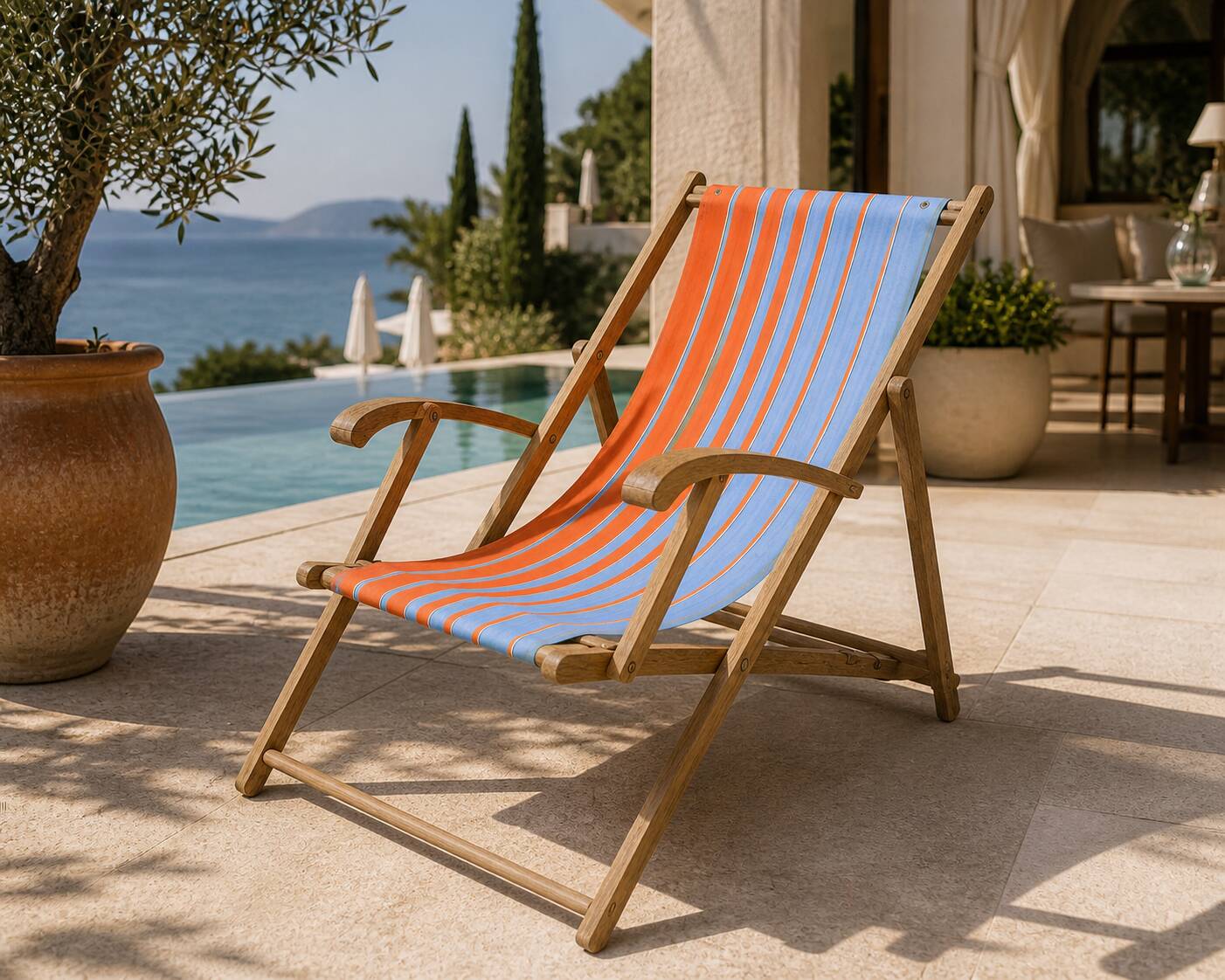 Vintage deck chair with orange and blue striped fabric, original patina.
