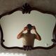 Pair of large antique Rococo style Louis XV mirrors in carved solid wood.